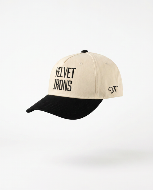 Beige and black cap with 'Velvet Irons' text on a white background